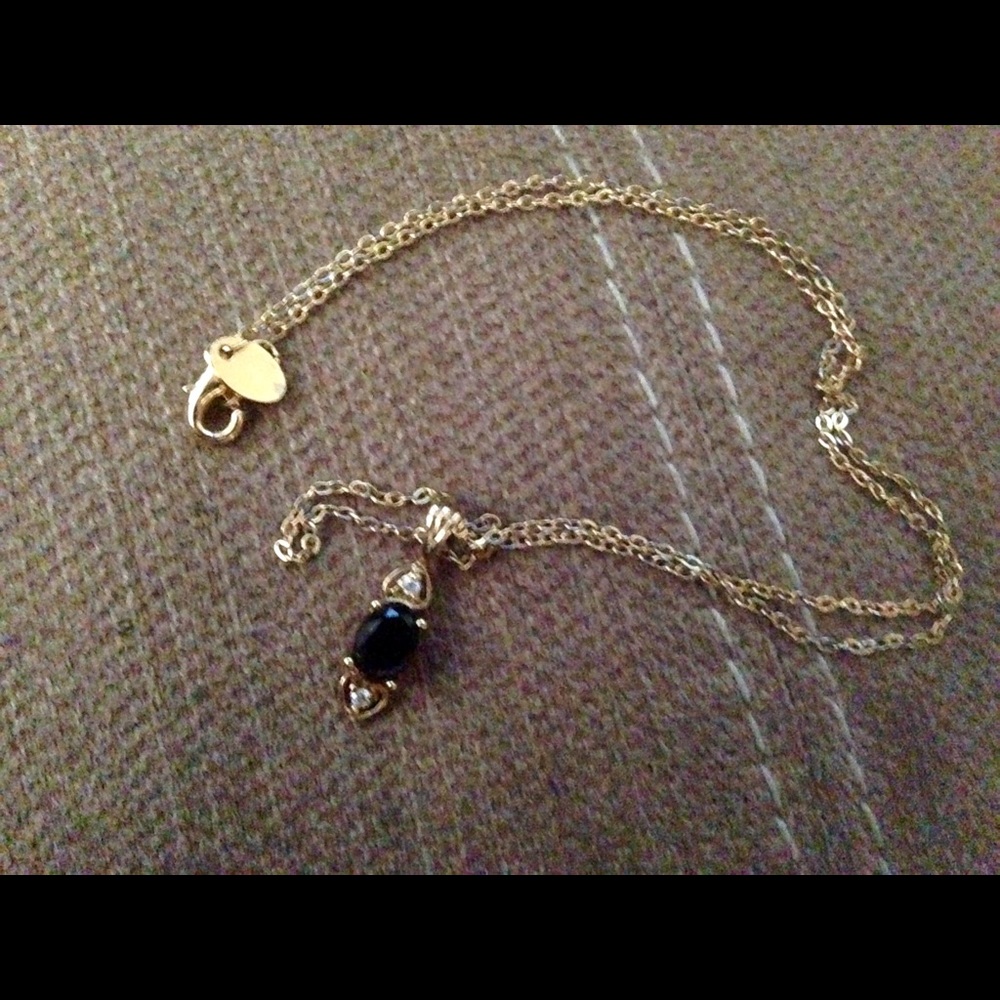 Black Onyx with 2 cz on 18" gold filled chain.